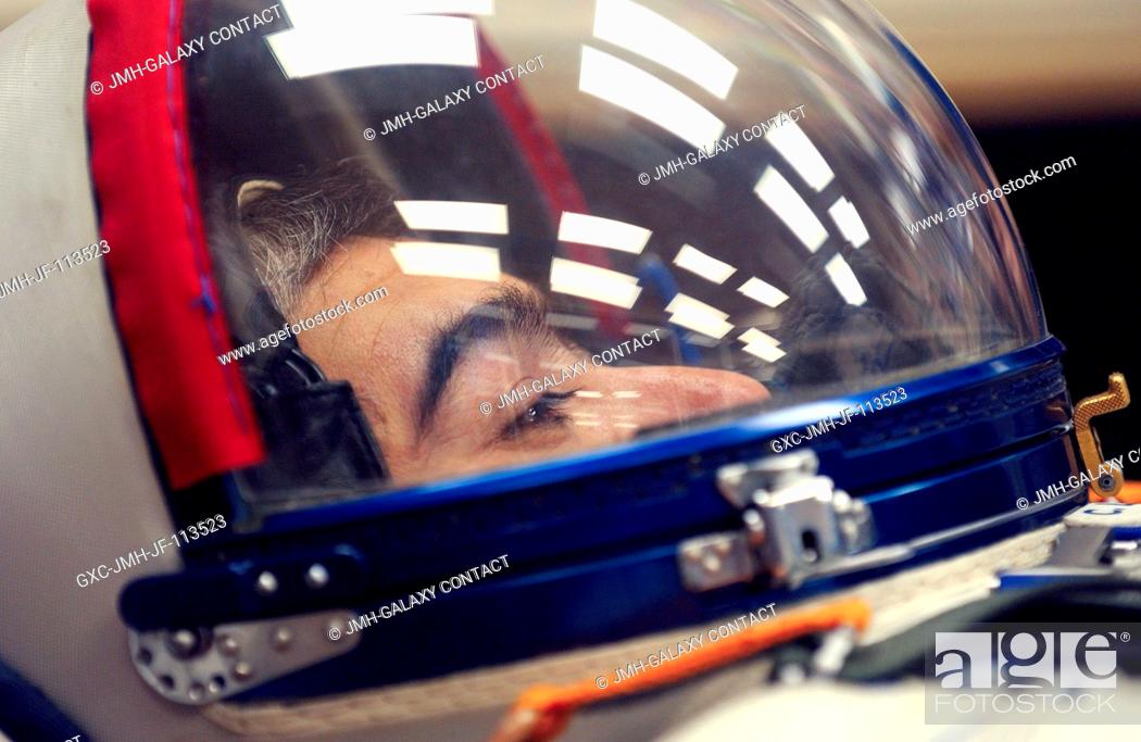 Stock Photo: Cosmonaut Salizhan S. Sharipov, Russia's Federal Space Agency Expedition 10 flight engineer and Soyuz commander, donned his launch and entry suit and climbed.