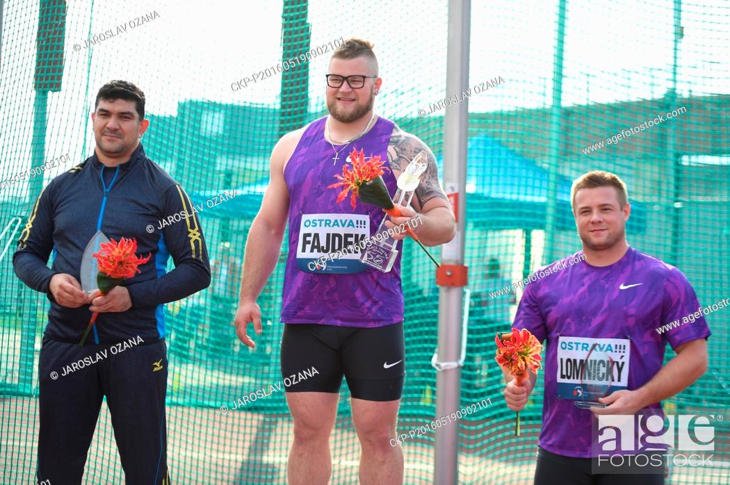 Stock Photo: Winner hammer thrower Pawel Fajdek from Poland (centre), second placed Dilshod Nazarov from Tajikistan (left) and third placed Marcel Lomnicky from Czech.