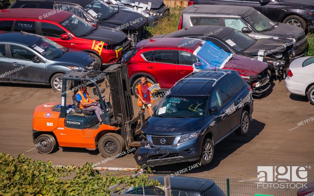 Stock Photo: Odessa, Ukraine 09. 16. 2019. Broken cars for export in the cargo port and container terminal in Odessa, Ukraine, on a sunny day.