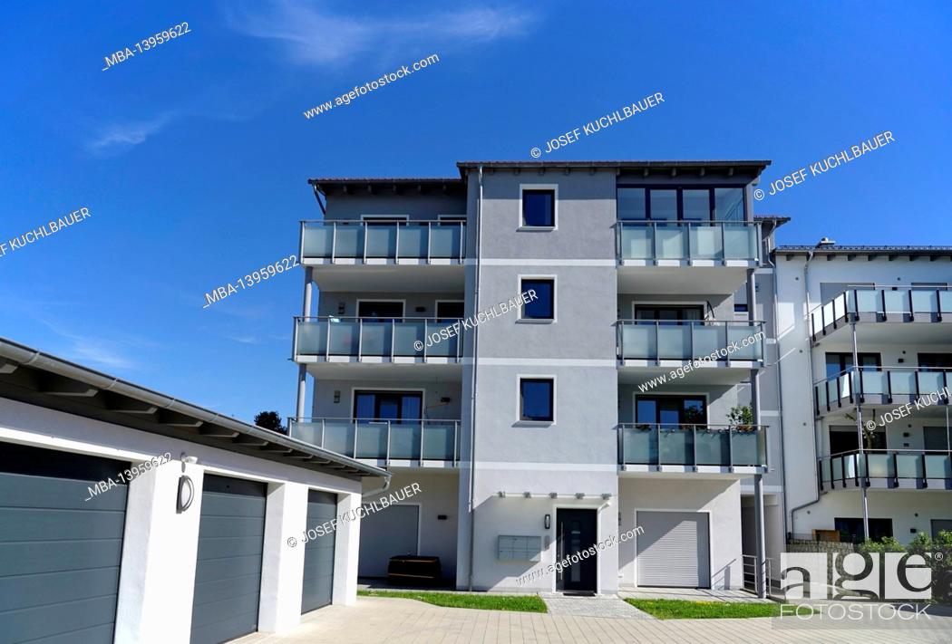 Stock Photo: Germany, Bavaria, Upper Bavaria, Altötting district, residential complex, balconies with frosted glass panes, garages, flat roof, entrance area, pavement.