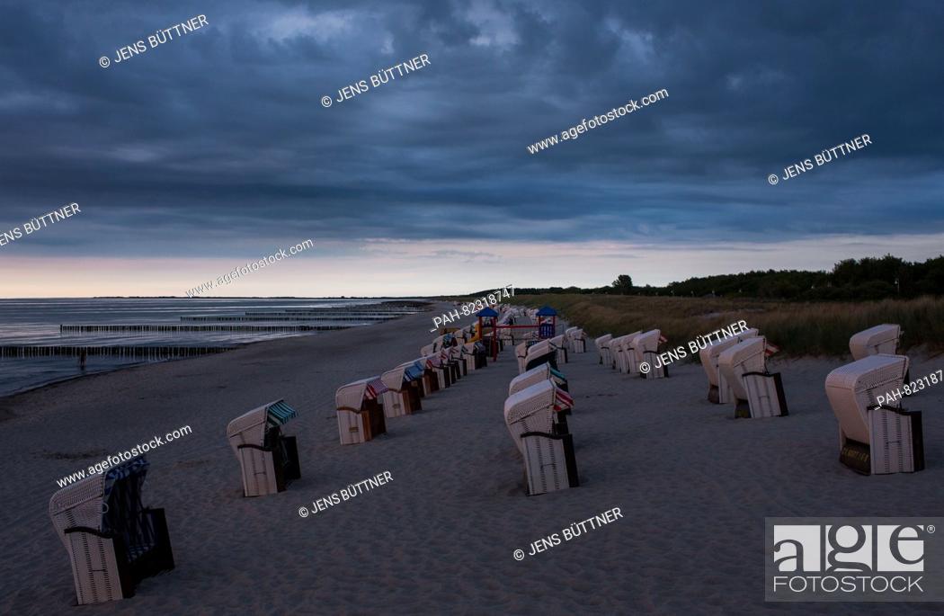Stock Photo: Empty beach chairs on the Baltic coast near the Baltic Sea Spa Graal-Mueritz (Mecklenburg-Western Pomerania), Germany, 09 June 2016.