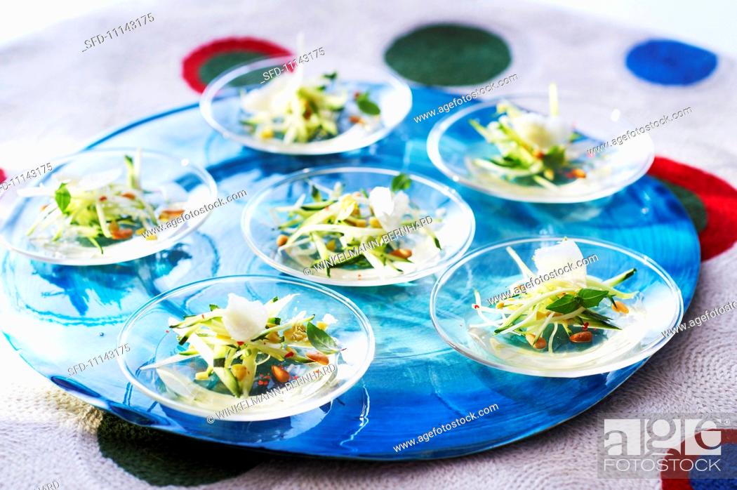 Stock Photo: Courgette salad with wine jelly and pine nuts.