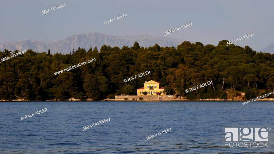 Stock Photo: greece, greek islands, ionian islands, lefkada or lefkas, bay of nidri, view of the wooded islet madouri, villa, behind it mainland can be seen.