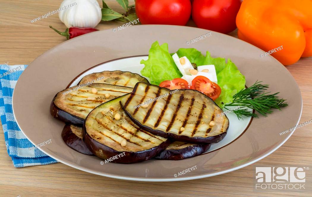 Stock Photo: Grilled aubergine with salad leaves and dill.