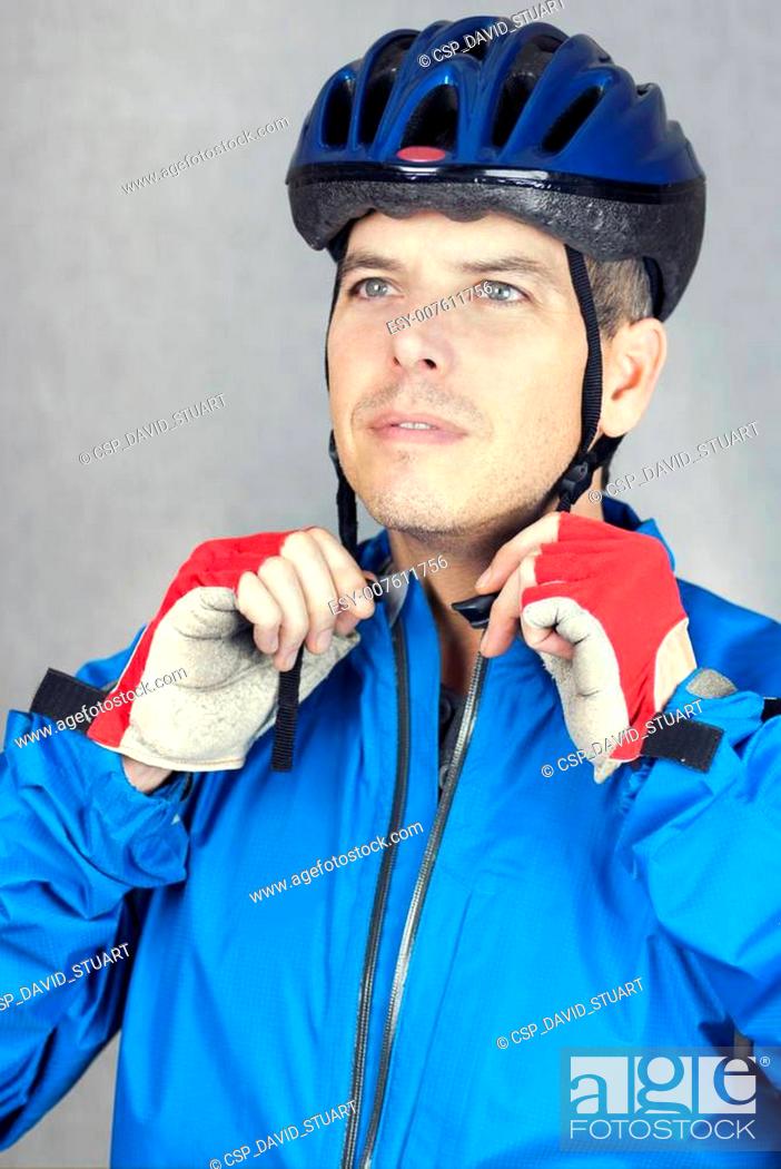 Stock Photo: Cyclist Puts On Helmet 3.