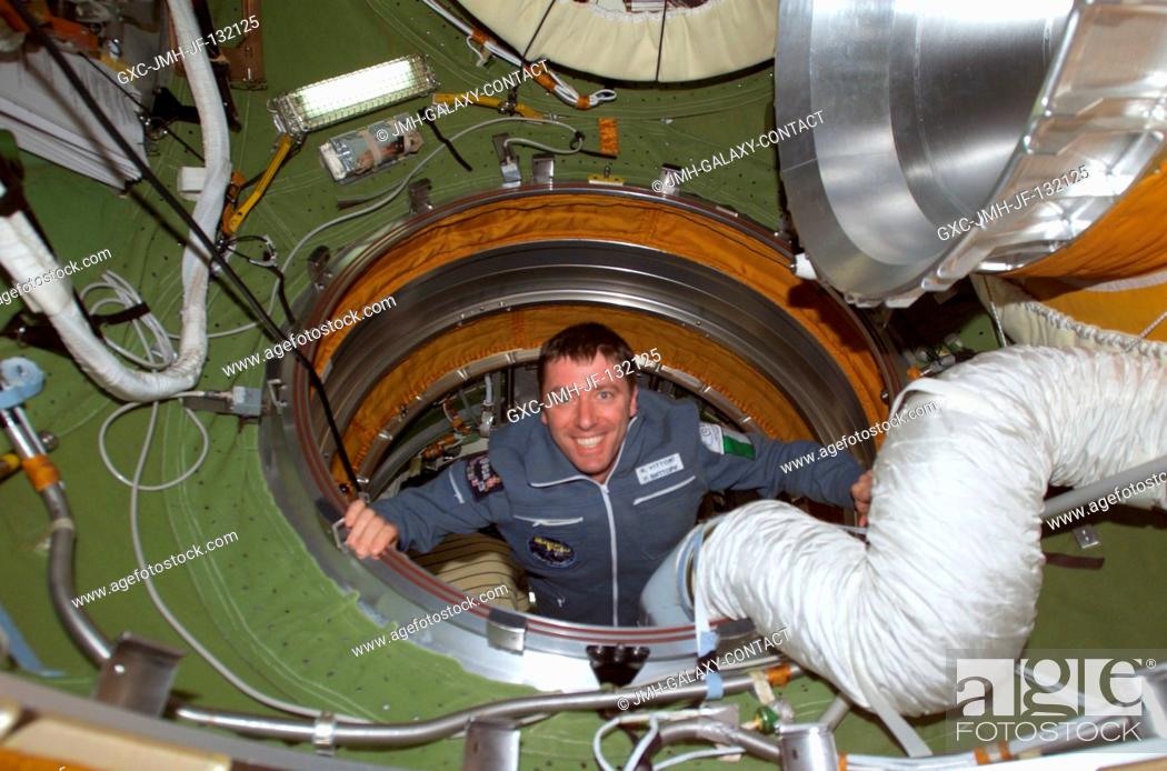 Stock Photo: Soyuz Taxi Flight Engineer Roberto Vittori of the European Space Agency (ESA) enters the functional cargo block's (FGB) pressurized adapter on the International.