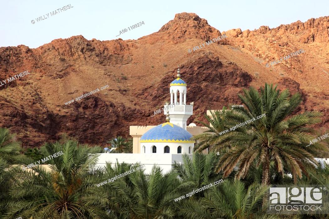 Stock Photo: colorful mosque in wadi with date palms at the village of Fanja, Hajar al Gharbi, Sultanate of Oman, Asia.