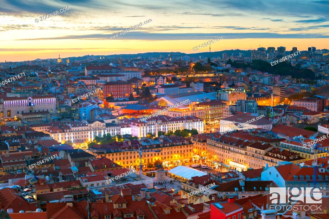 Stock Photo: Aerial night cityscape of Lisbon downtown, red rooftops, illuminated Praca do Pedro IV square, afterglow skyline, Portugal.