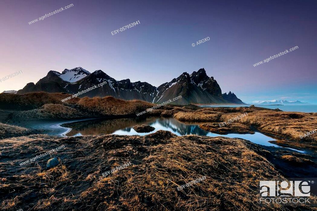 Stock Photo: Magical Vestrahorn Mountains and Beach in Iceland at sunrise. Panoramic view of an Icelandic amazing landscape.