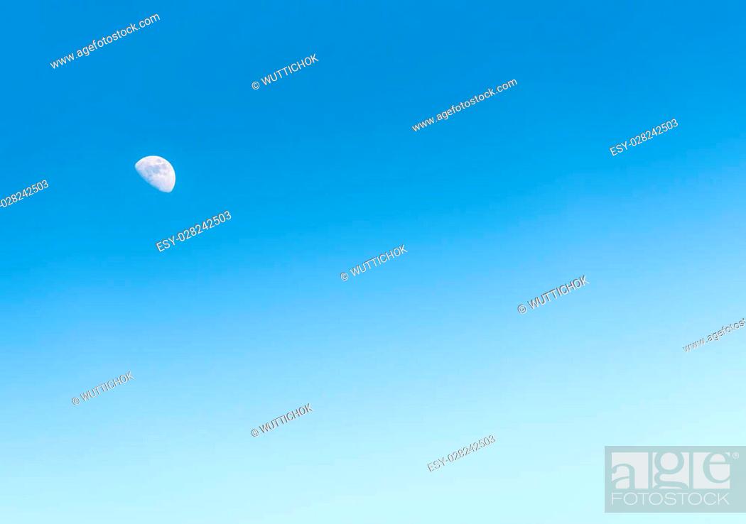 Stock Photo: natural scenes of the moon in the day on blue sky.