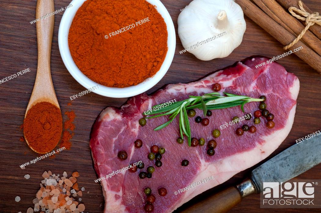 Stock Photo: raw uncooked ribeye beef steak butcher selection.