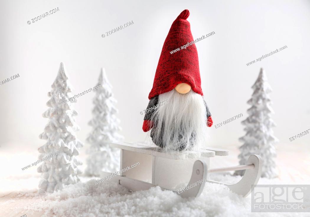 Stock Photo: Christmas imp on sleigh with snowy landscape. Christmas decoration.