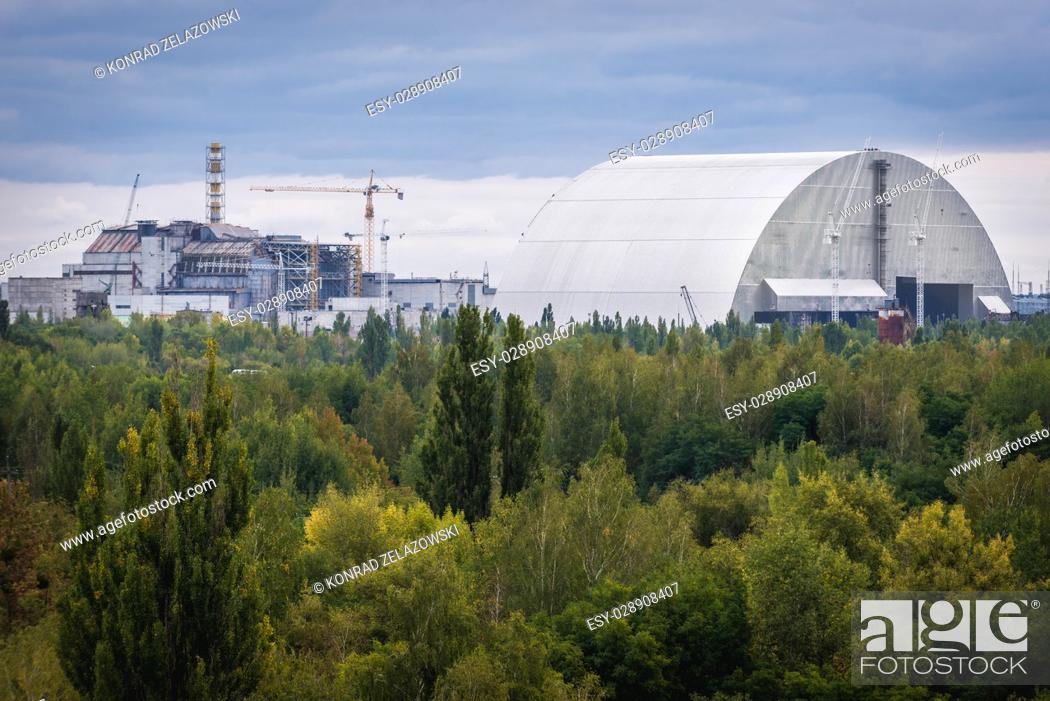 Stock Photo: New Safe Confinement of Chernobyl Nuclear Power Plant in Zone of Alienation around the nuclear reactor disaster in Ukraine.