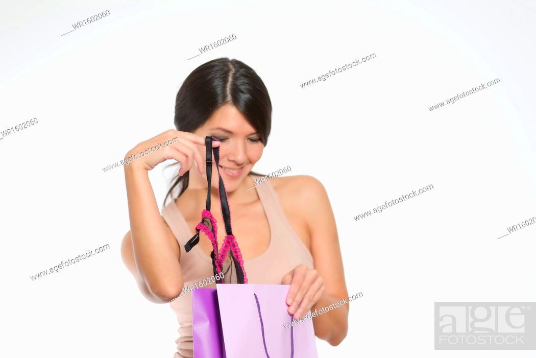 Photo de stock: Woman giving a sneak peek at new lacy lingerie.