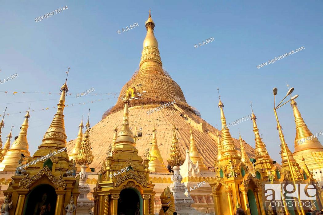 Stock Photo: Shwedagon Pagoda is a gilded stupa located in Yangon, Myanmar. The 99 metres tall pagoda is situated on Singuttare Hill, to the West of Kandawgyi Lake and.