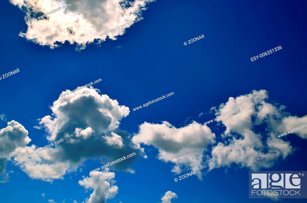Stock Photo: Dramatic clouds against a blue sky.