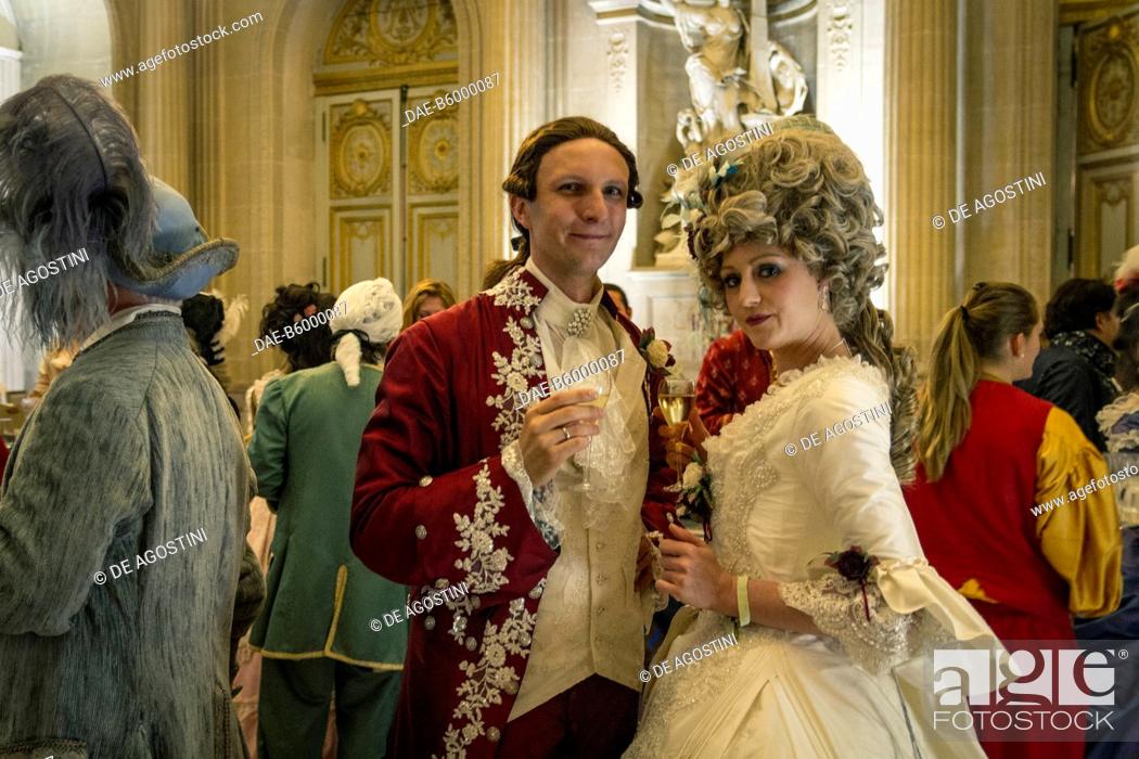 Stock Photo: Courtship party (Fete galante) with participants wearing clothes from the Louis XIV period, Palace of Versailles, France. Historical reenactment.