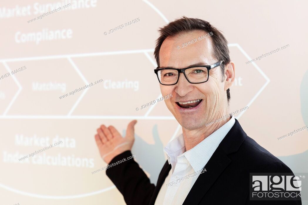 Photo de stock: Portrait of smiling businessman during presentation.