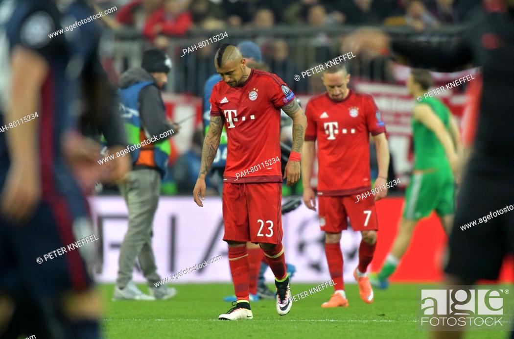 Stock Photo: Munich's Arturo Vidal (l) and Franck Ribery leaving the pitch after the second leg soccer match between Bayern Munich and Atletico Madrid at the Allianz Arena.
