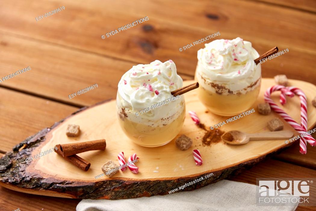 Stock Photo: glasses of eggnog with whipped cream and anise.