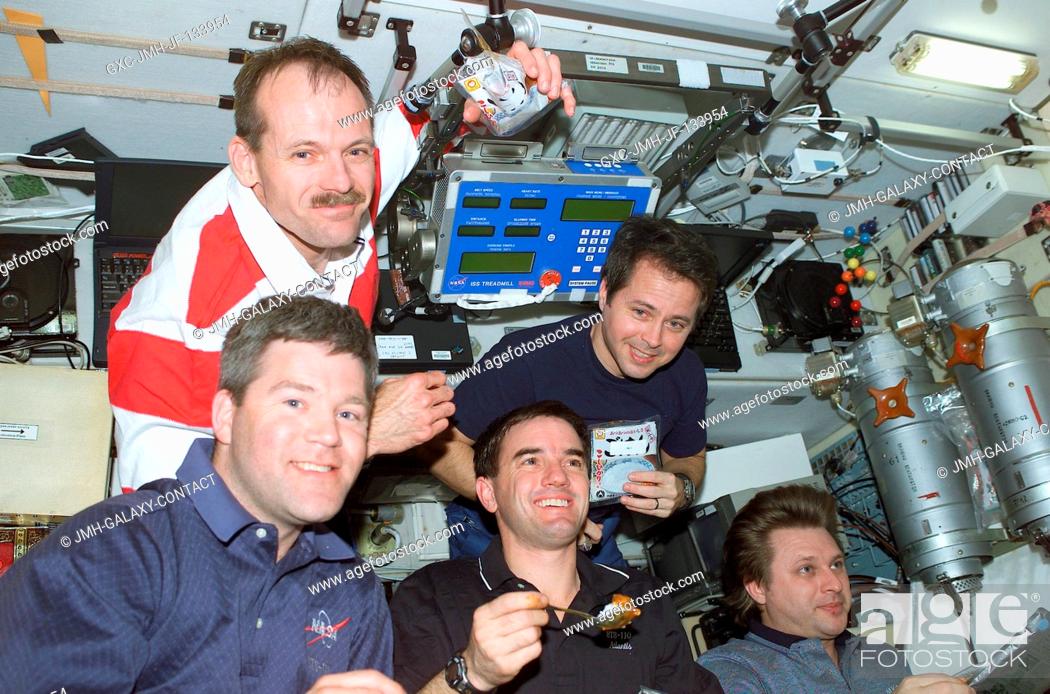 Stock Photo: Astronauts Stephen N. Frick (bottom left), STS-110 pilot; Rex J. Walheim, mission specialist; cosmonaut Yury I. Onufrienko.