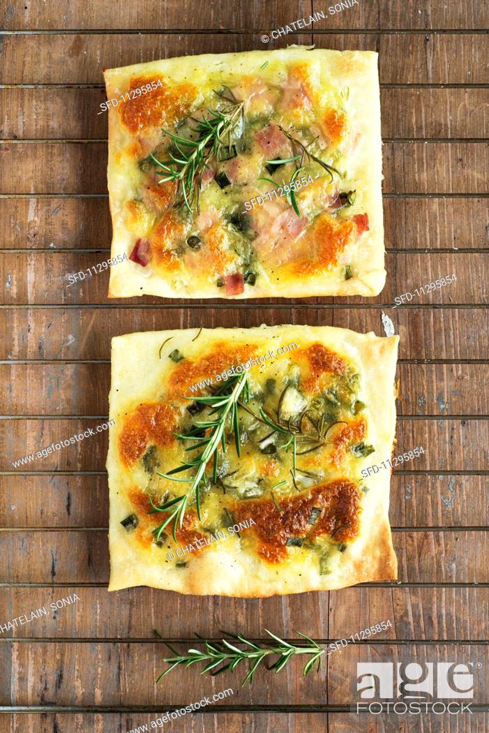 Stock Photo: Mozzarella, onion and rosemary pizzas.