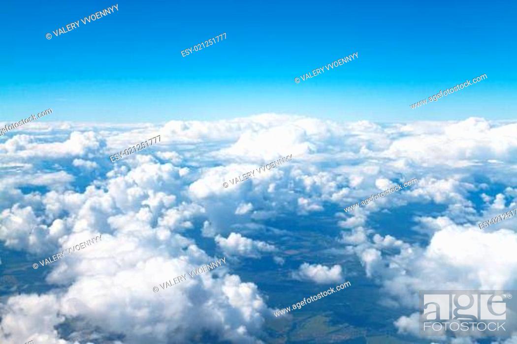 Stock Photo: above view of white clouds in blue sky.