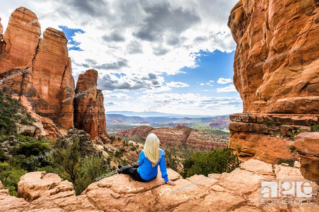 Stock Photo: Caucasian woman admiring scenic view in desert landscape.