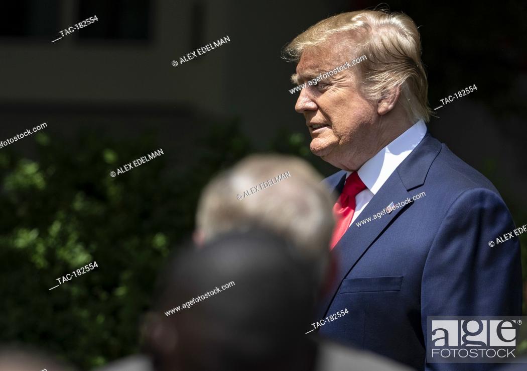 Stock Photo: U.S. President Donald Trump enters the rose garden before delivering remarks prior to presenting the Commander-in-Chief’s trophy to the team in the White House.