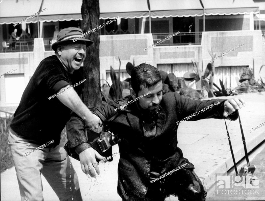 Stock Photo: Apr. 20, 1966 - Rome, Italy - Actor MICKEY ROONEY was born on September 23, 1920 in Brooklyn, New York, pictured helping a photographer remove his gear after.