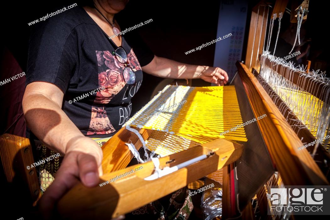 Stock Photo: old woman weaving with a traditional wooden machine. La Orotava village. Tenerife island.