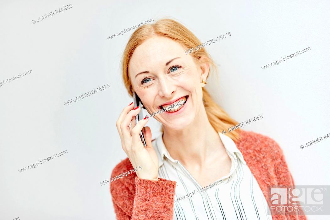Stock Photo: Woman talking via cell phone.
