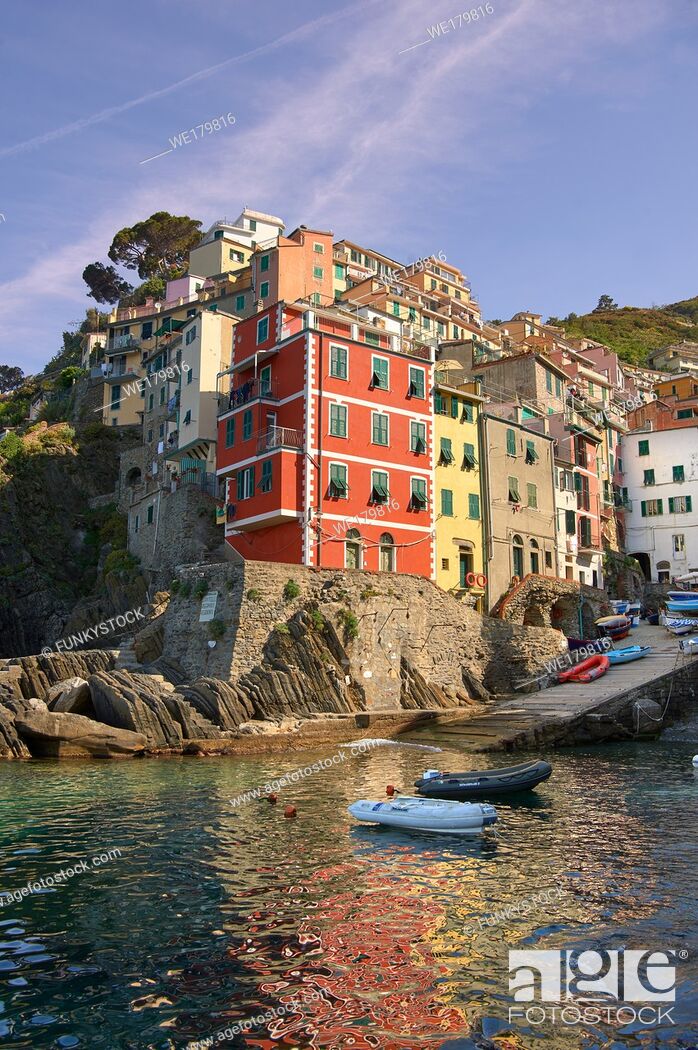Stock Photo: Fishing village and harbour of Riomaggiore at sunrise, Cinque Terre National Park, Liguria, Italy.