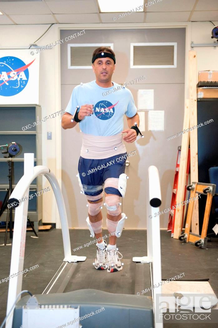 Stock Photo: NASA astronaut Joe Acaba, Expedition 3132 flight engineer, participates in a treadmill kinematics baseline data collection session in the Planetary and Earth.