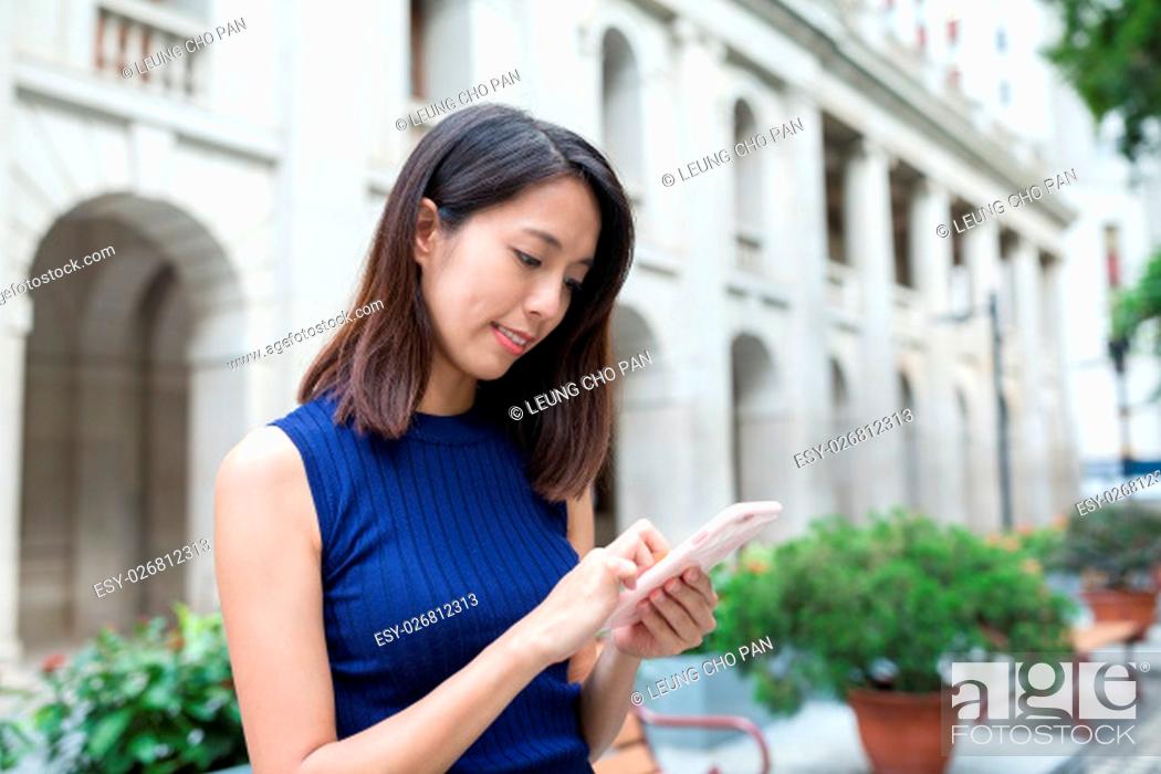 Stock Photo: Young woman use of mobile phone.