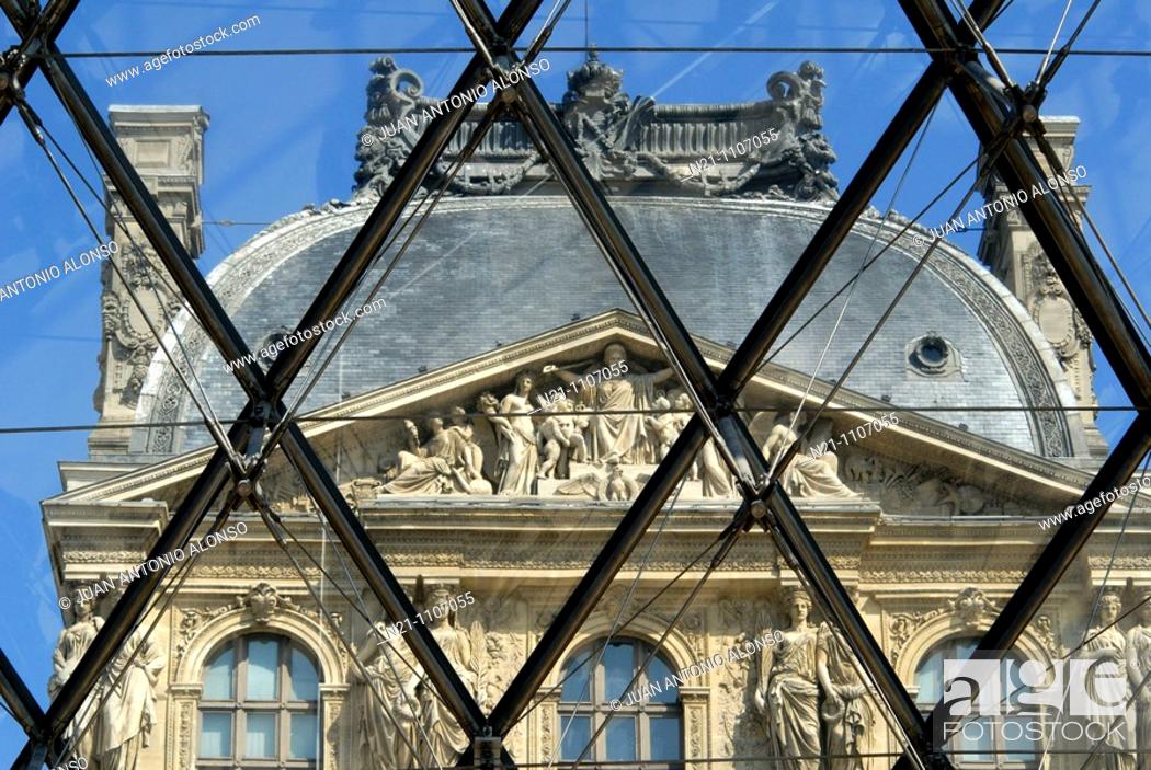 Stock Photo: Detail of the main façade of the Louvre Museum through Ming Pei’s glass and steel Pyramide. Paris, France, Europe.