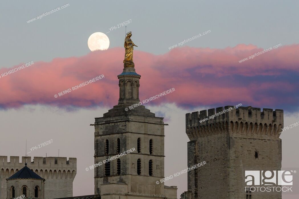 Stock Photo: Papal palace (Palais des Papes) and cathedral Notre Dame with full moon, Avignon, France.