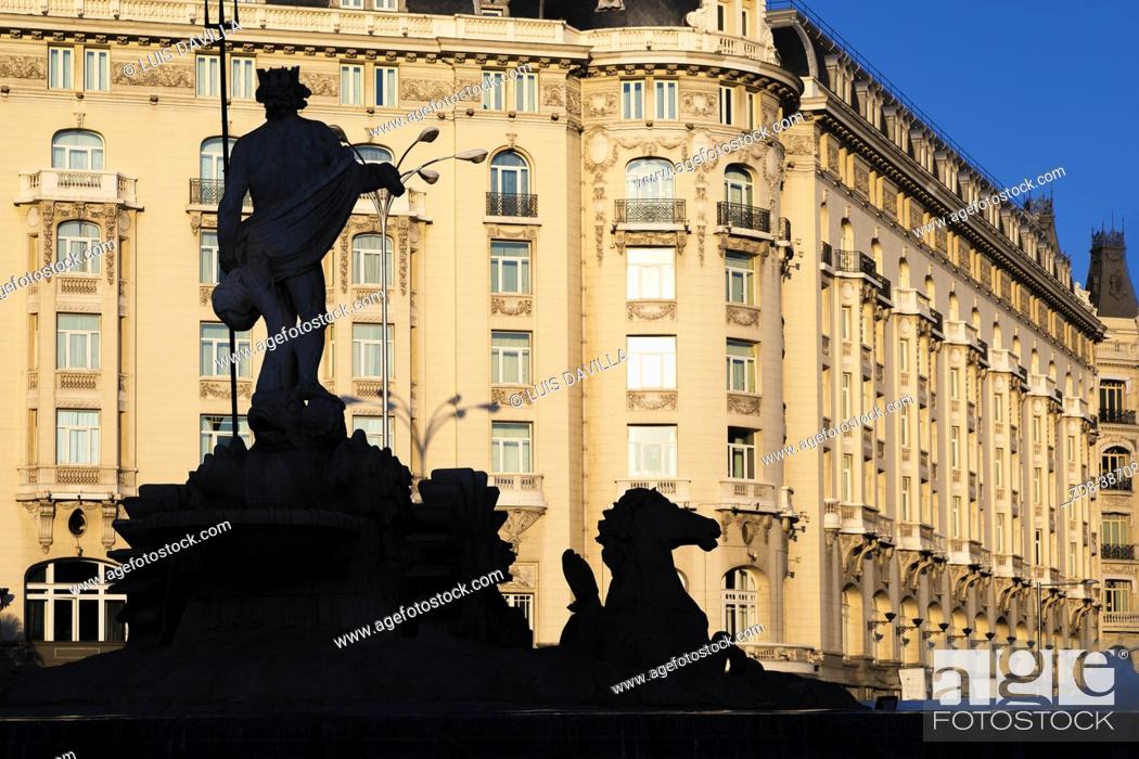 Photo de stock: neptuno fountain silhouette with the palace hotel. madrid. spain.