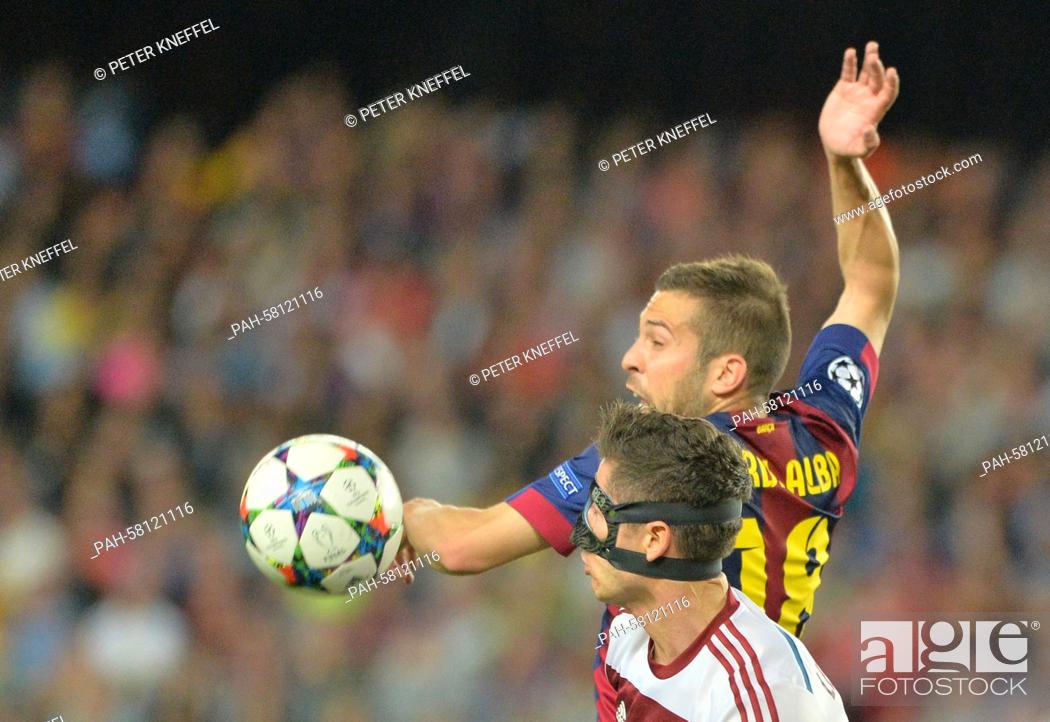 Stock Photo: Barcelona's Jordi Alba (top) and Munich's Robert Lewandowski vie for the ball during the UEFA Champions League semi-final first leg soccer match between.