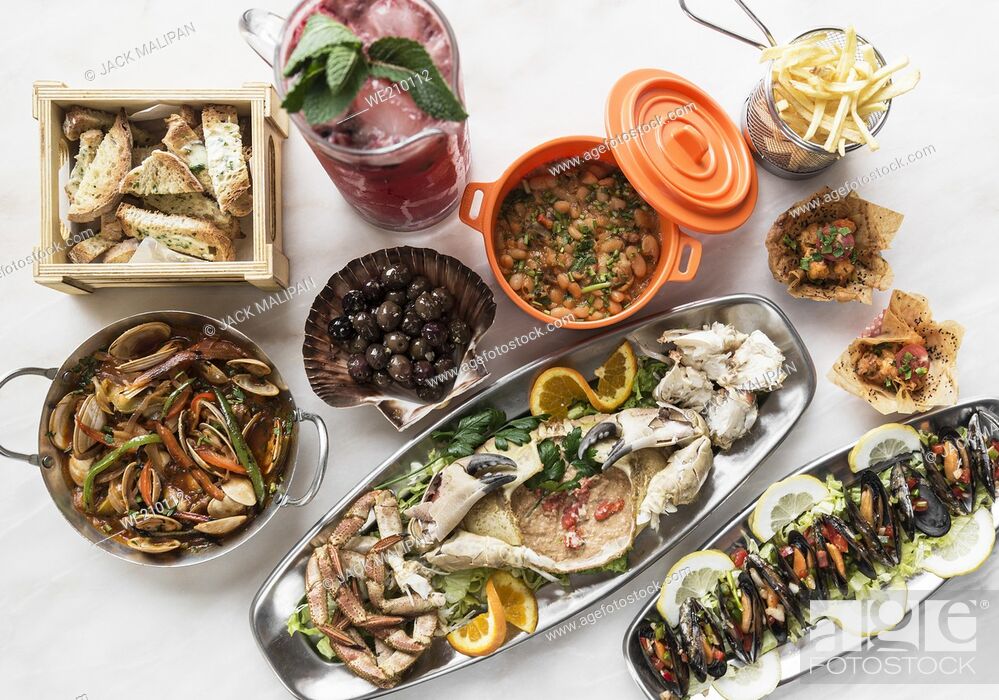 Stock Photo: mixed spanish gourmet tapas sharing set selection on restaurant table in barcelona.