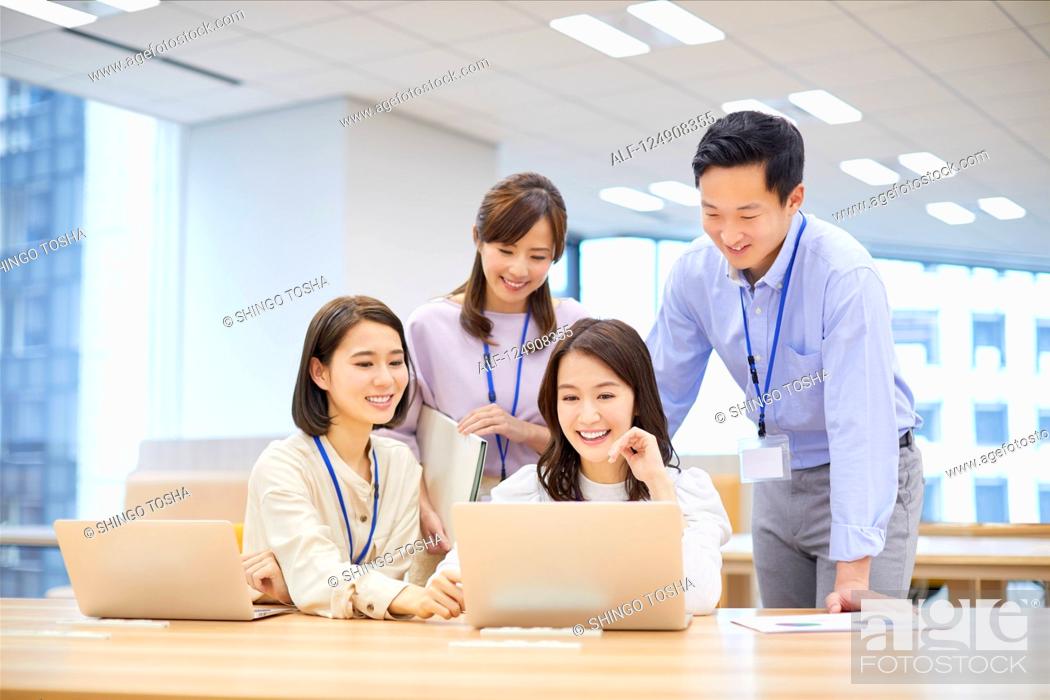 Stock Photo: Japanese businesspeople in the office.