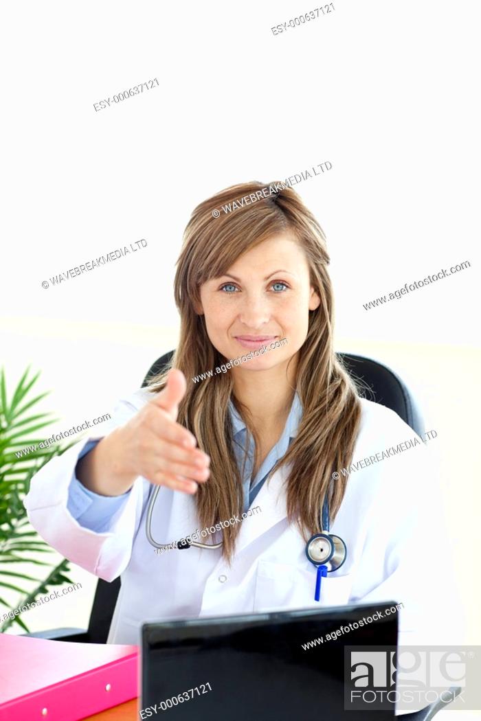 Stock Photo: Cute female doctor looking at the camera in her office.