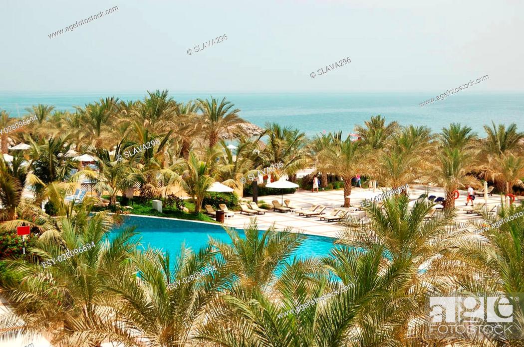 Stock Photo: Swimming pool and beach at luxury hotel, Ras Al Khaimah, UAE.