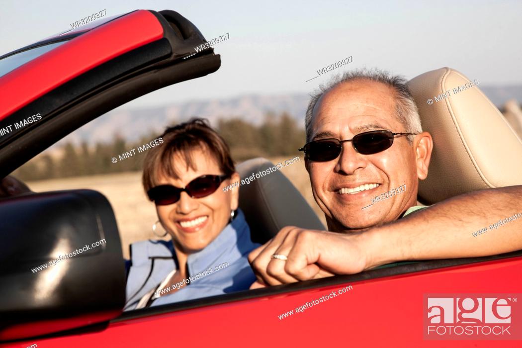Stock Photo: A hip senior Hispanic couple on a road trip in eastern Washington State, USA.