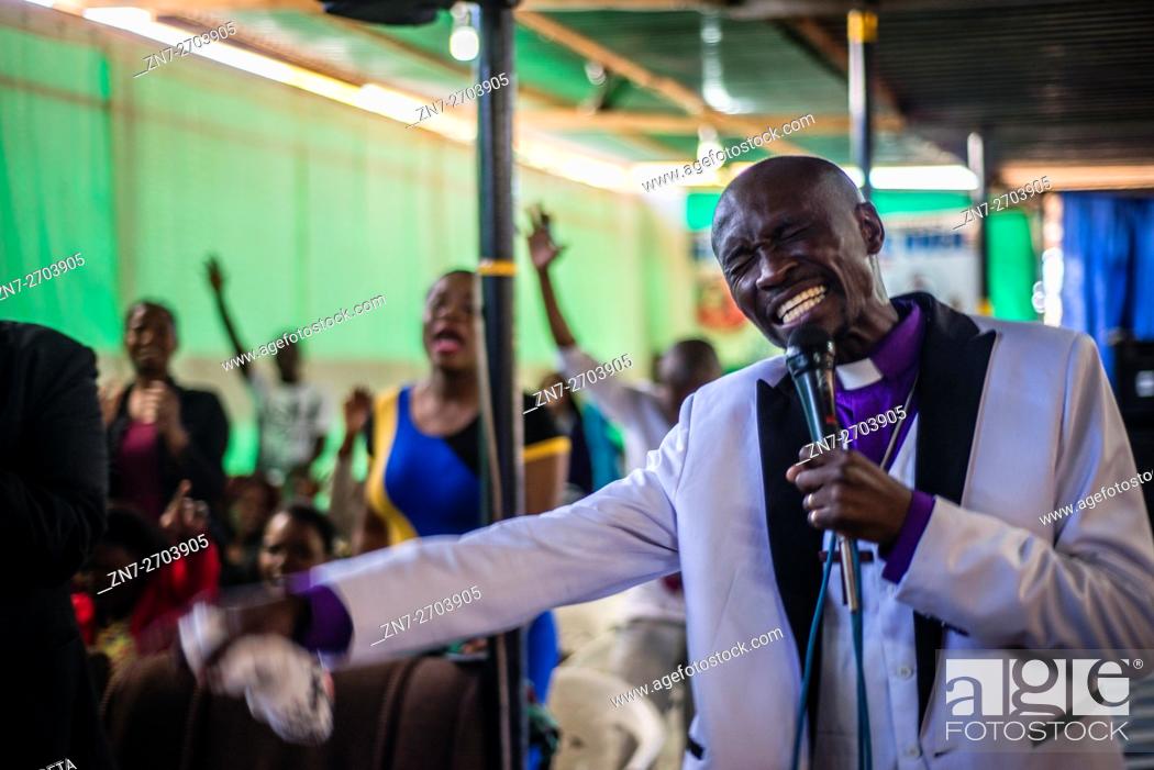 Stock Photo: Prophet Katebe talks to parishioners during a Sunday service in Livingstone, Zambia.