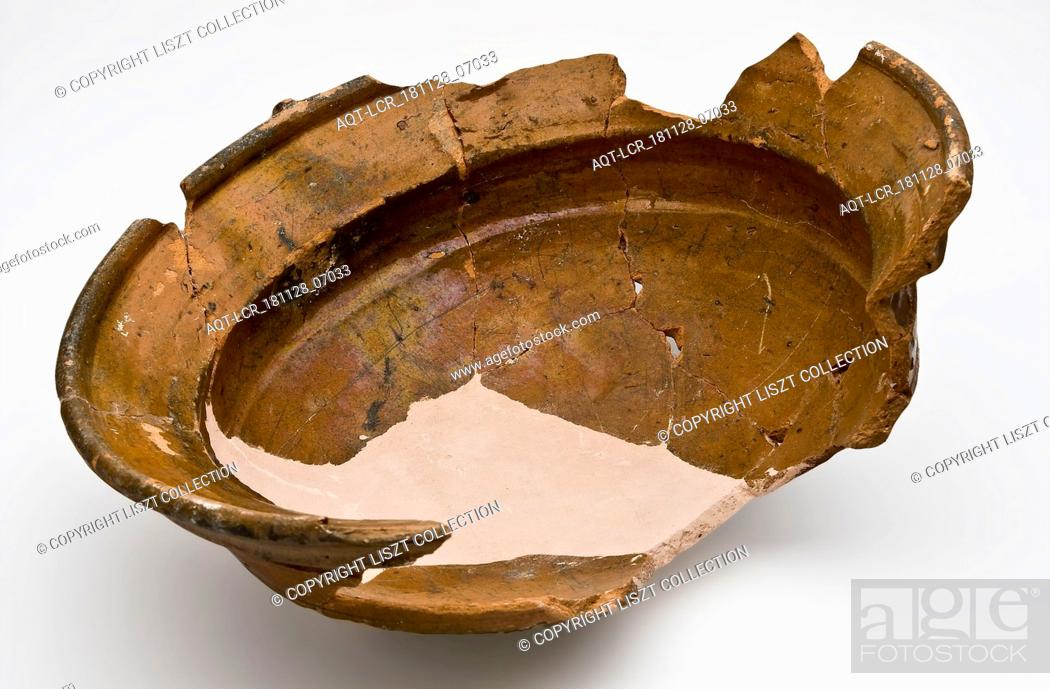 Stock Photo: Fragment earthenware cooking pot with wide top edge and two bands, cooking pot crockery holder kitchen utensils earthenware ceramics earthenware glaze lead.
