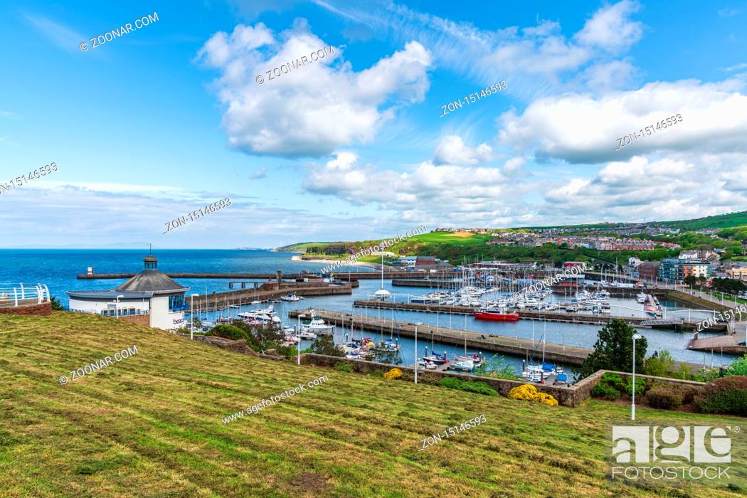 Stock Photo: Whitehaven, Cumbria, England, UK - May 03, 2019: View over the Whitehaven Marina and Bransty in the background.
