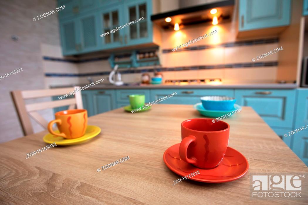 Stock Photo: Tea cups on the table against the background of the kitchen.