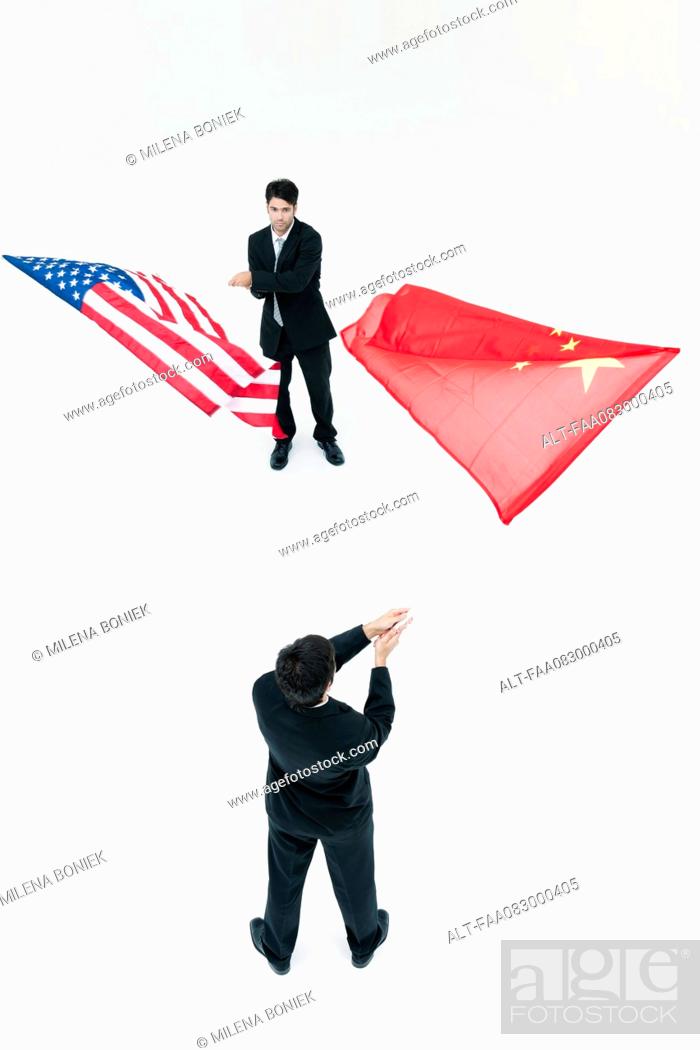 Men standing face to face, waving Chinese and American flags, Stock Photo,  Picture And Royalty Free Image. Pic. ALT-FAA083000405 | agefotostock