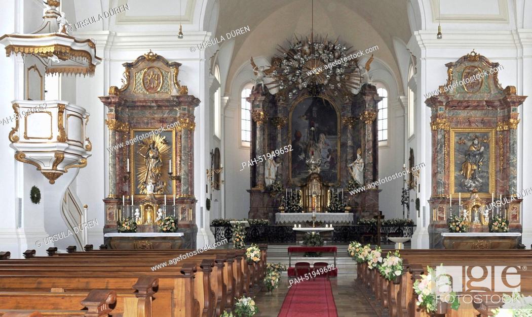 Stock Photo: Flowers decorate the central nave and the altar in the church of Saint Joseph prior to the wedding of Maria Theresia von Thurn and Taxis and Hugo Wilson in.